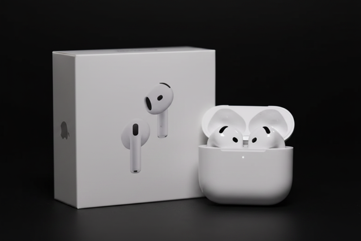 Apple AirPods with charging case on black background