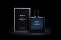 Bleu de Chanel cologne bottle and box on black background